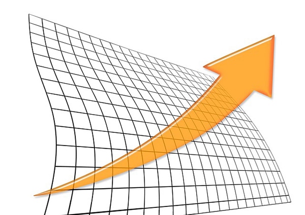 An orange arrow on a grid background representing an upward trend