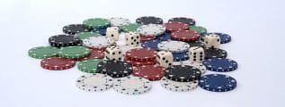 A pile of poker chips and a few dice