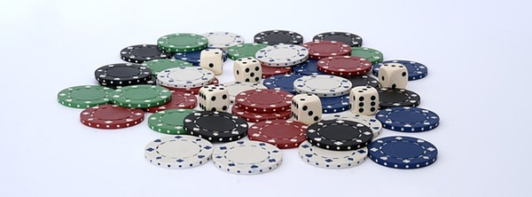 A pile of poker chips and a few dice