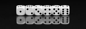 A photo of six white standard dice